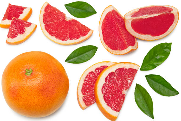 istock grapefruit with slices and green leaves isolated on white background top view. clipping path 1313447362
