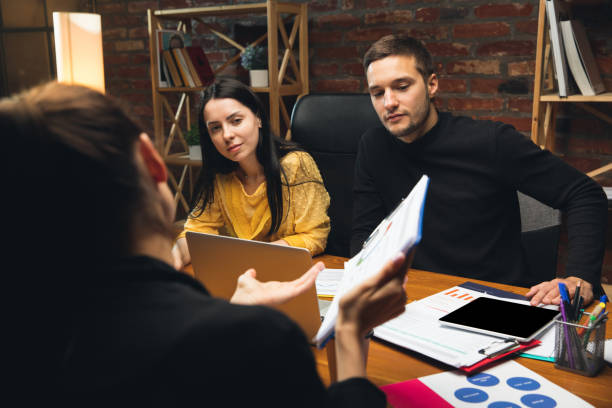 istock Colleagues working together in modern office using devices and gadgets during creative meeting 1313448142