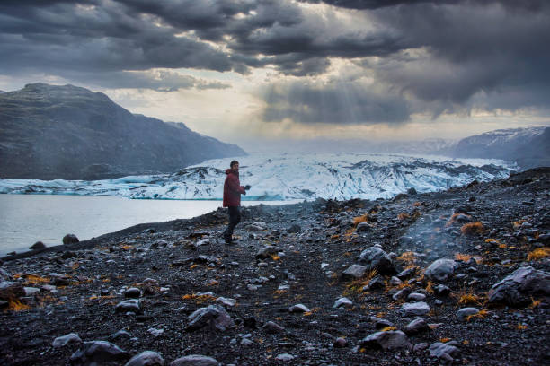 istock Man visiting Solheimajokull Glacier near Vik in south Iceland 1313449672