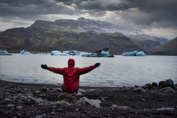 istock Man visiting Solheimajokull Glacier near Vik in south Iceland 1313449780