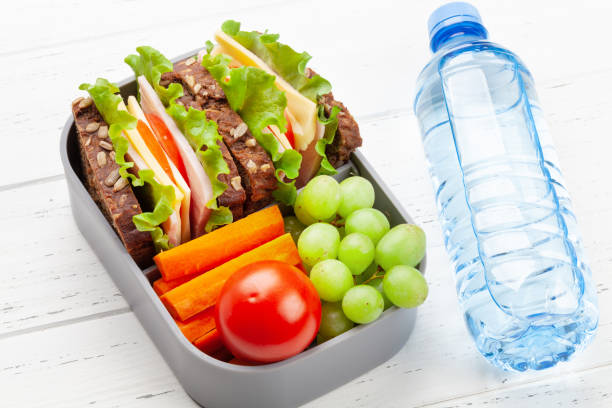 istock Healthy school lunch box with sandwich and fresh vegetables 1313454644