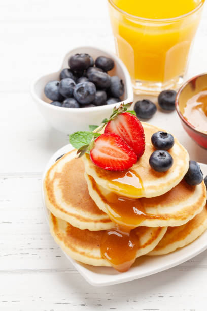 istock Healthy breakfast with pancakes and orange juice 1313454671