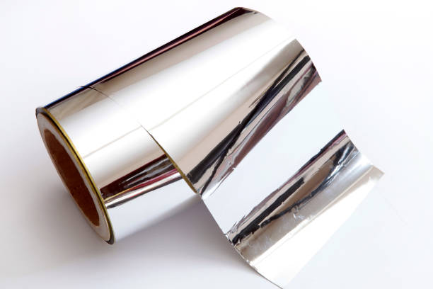 Roll of aluminium foil on white background