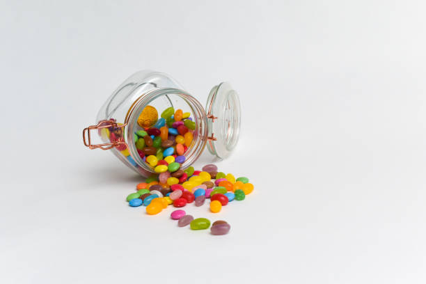 istock Junk food sweets and chocolate candy in a jar isolated 1313456366
