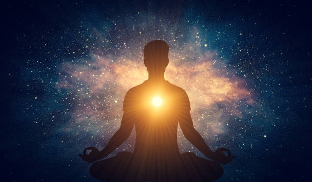 Man and soul. Yoga lotus pose meditation on nebula galaxy background Man and soul. Yoga lotus pose meditation on nebula galaxy background. Zen, spiritual well-being serene people stock pictures, royalty-free photos & images