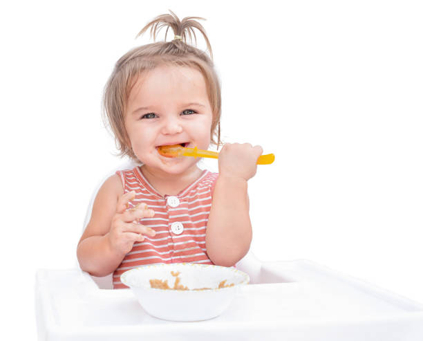 istock Baby eating porridge 1313457680