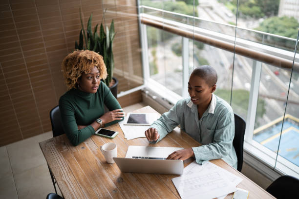 istock Financial advisor or real estate agent talking to customer at home 1313460596