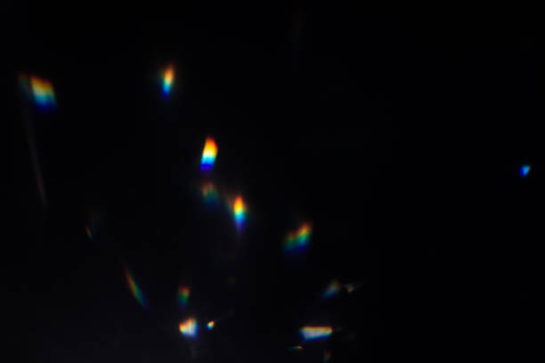 istock colorful warm rainbow crystal light leaks on black background 1313461642