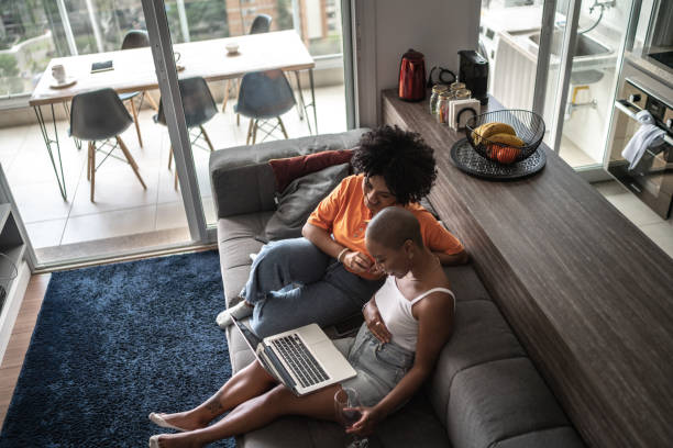istock Friends doing a video call or watching something on laptop at home 1313461884