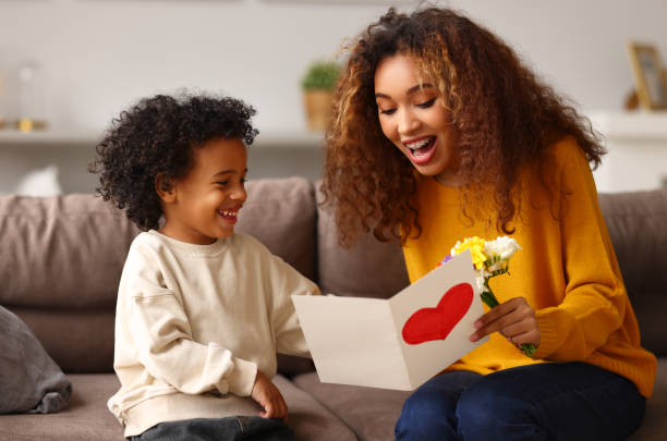 istock Young mixed race woman getting congratulations from son on Mothers day 1313462326