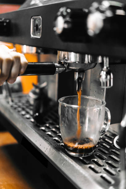 istock Hand pulling a lever that takes out black. American coffee. 1313463255