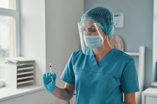 istock oung female paramedic in protective workwear 1313466162