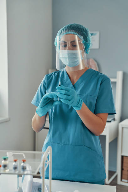 istock Young female paramedic in protective workwear 1313466254