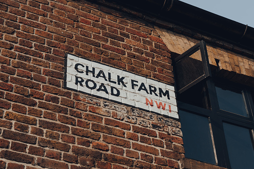 London, UK - August 12, 2020: Street name sign on Chalk Farm Road by Camden Market, London. Started with 16 stalls in 1974, Camden Market is one of the busiest retail destinations in London.