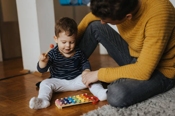 istock Young father and little son playing at home 1313467616