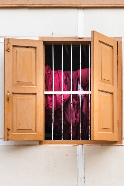 Open window. It can see clothes hanging out to dry. Front view.