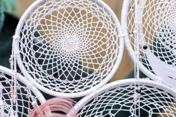 istock Handmade dream catcher with feathers threads and beads rope hanging 1313470296