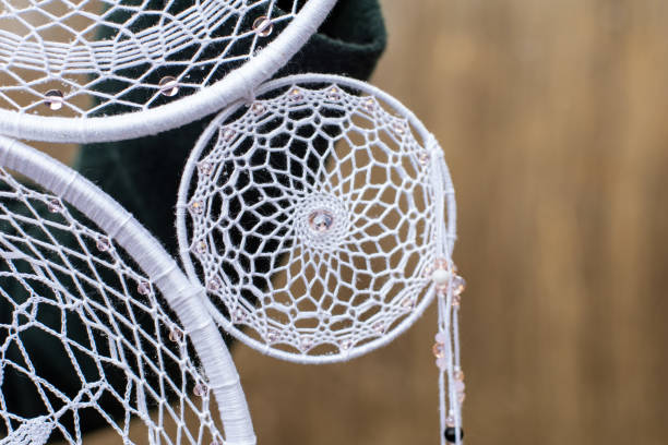 istock Handmade dream catcher with feathers threads and beads rope hanging 1313470305
