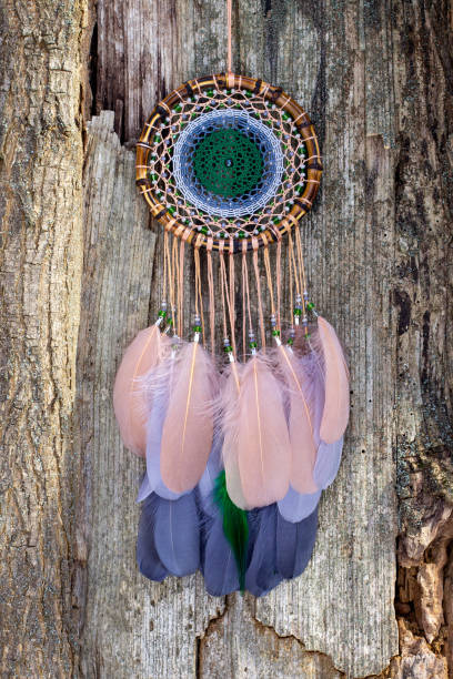 istock Handmade dream catcher with feathers threads and beads rope hanging 1313470383