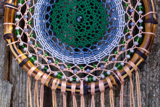 istock Handmade dream catcher with feathers threads and beads rope hanging 1313470394