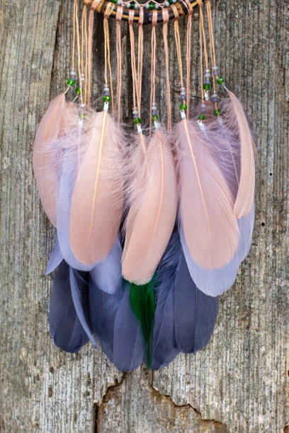 istock Handmade dream catcher with feathers threads and beads rope hanging 1313470405