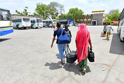 Beawar, Rajasthan, India, April 19, 2021: Passengers arrive at Roadways Bus Station to board buses to their native places amid coronavirus cases surge in Beawar. Rajasthan Government declared lockdown called Jan Anushasan Pakhwada (Public Discipline Fortnight) for prevention of pandemic till 3 May