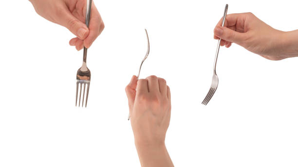 istock Fork in woman hand isolated on white. 1313473120