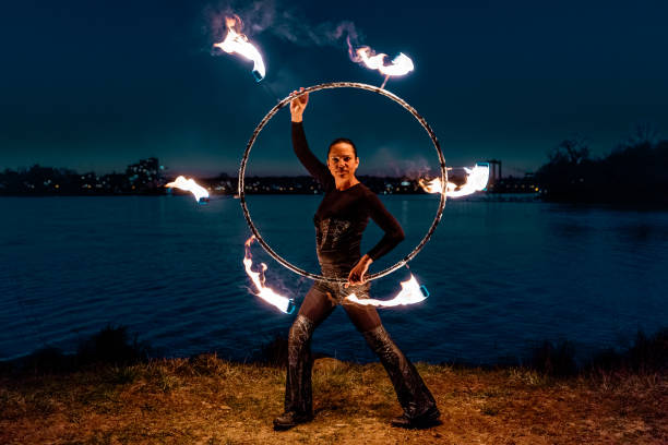 istock Fire artist performing at night in front of river 1313474573