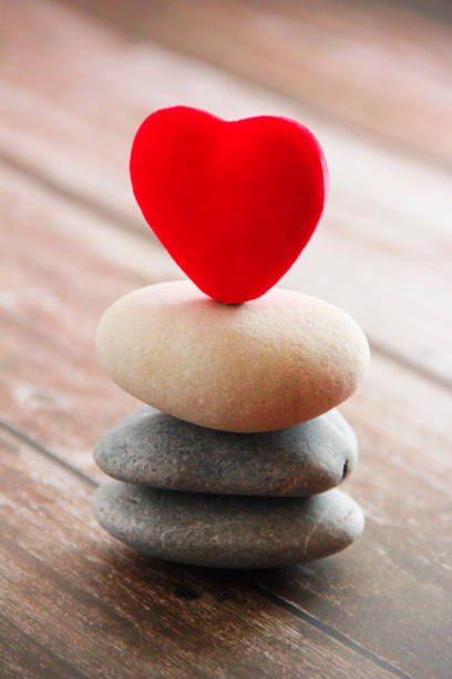 istock red velvet heart on gray stones 1313475125