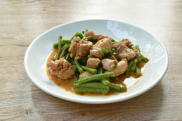 istock stir fried slice yarg long bean with chicken curry sauce 1313476785