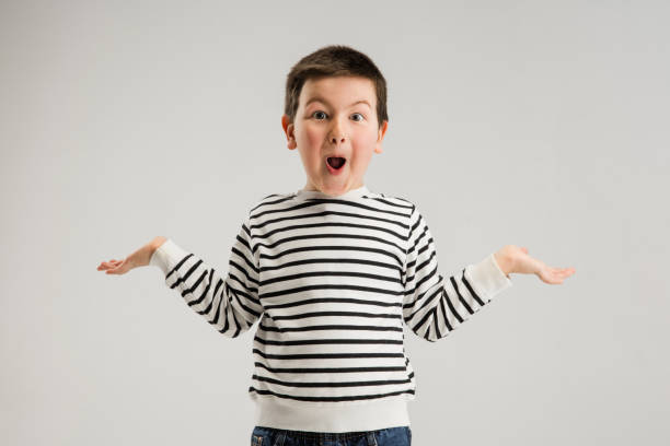 istock Caucasian boy isolated on white studio background. Copyspace. Childhood, education, emotions concept 1313476974