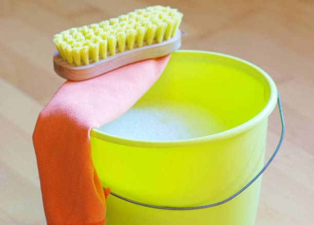 istock Yellow plaster bucket with brush 1313479306