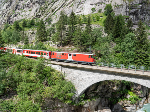 istock Swiss train on viaduct, train journey in Spring 1313481792