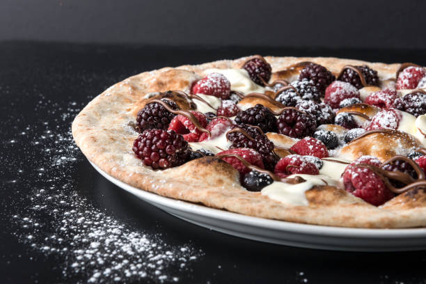 istock Dark and White Chocolate berry pizza 1313481810