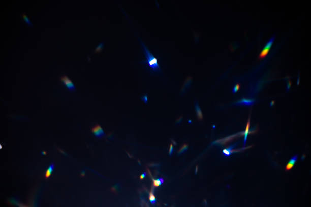 istock colorful warm rainbow crystal light leaks on black background 1313481860