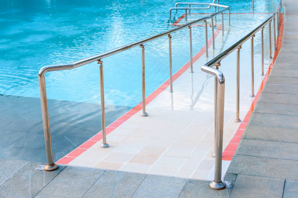 istock Staircase with handrails for lifting and descent in the swimming pool. 1313482099