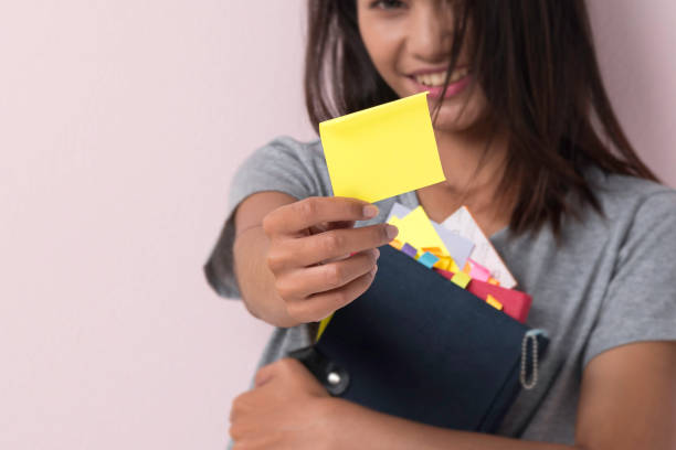 istock Young Asian Woman with Adhesive Note 1313484706