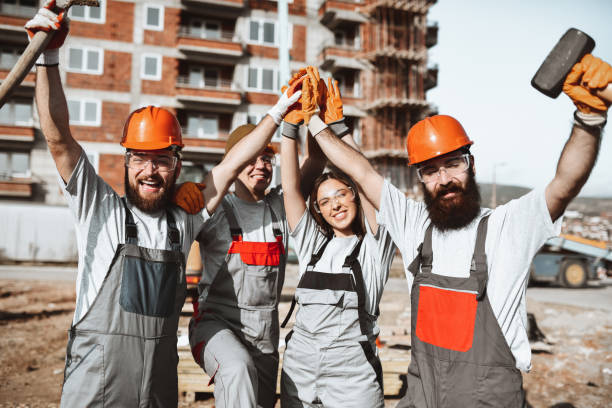 istock Happy Construction Workers Finishing Work For The Day 1313484754