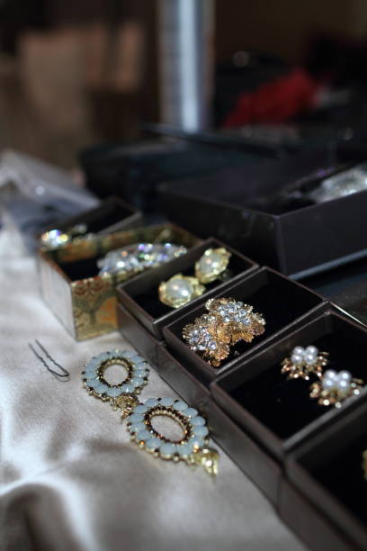 istock Put beautiful earrings on the bride's ears at the wedding 1313485182