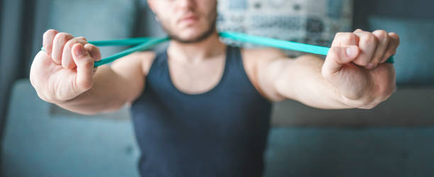 istock Young man exercising at home 1313485837