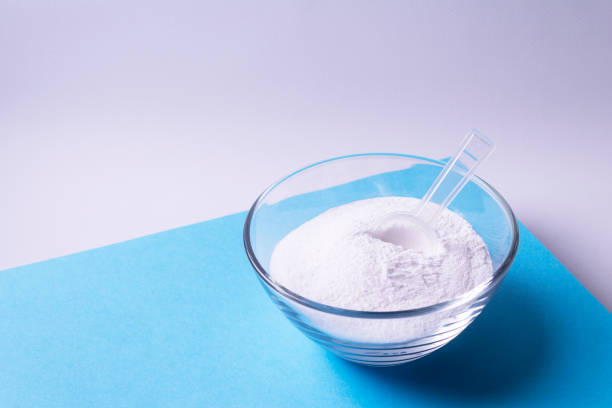 istock Collagen in a glass plate on a blue background. 1313486820