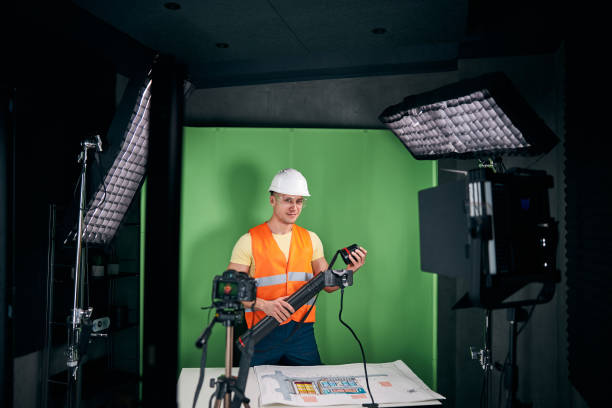 istock Joyful male builder recording video for construction blog 1313489213