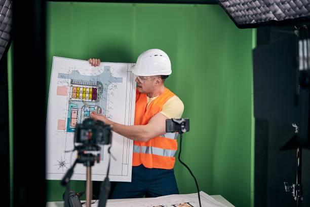 Handsome man builder recording video for construction blog