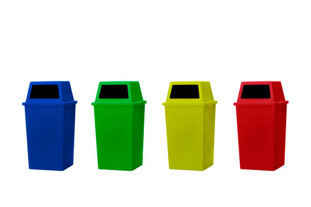 istock yellow, green, blue and red recycle bins isolated on white background. 1313489736