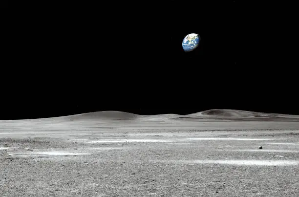 Photo of blue earth seen from the moon surface: Elements of this image are furnished by NASA