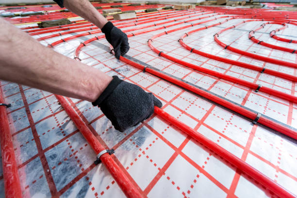 Pipefitter install system of underfloor heating system at home Pipefitter install system of underfloor heating system at home. hot spring stock pictures, royalty-free photos & images