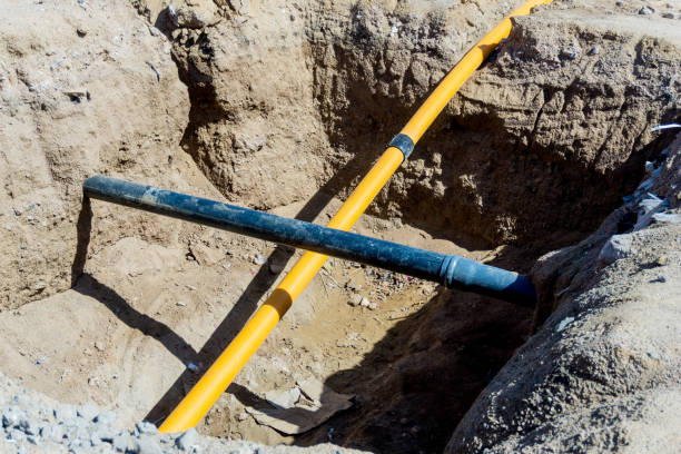 istock Electrical cables and optical fibres in the digging on a construction 1313490744