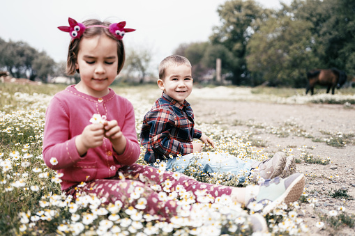 Portrait Of Child Boy And Girl Outdoors In Spring Season