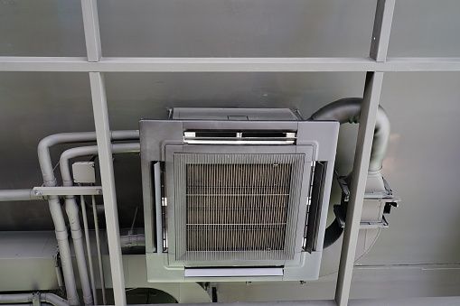 Black air conditioner system at ceiling