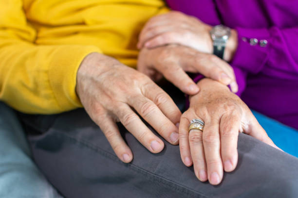 istock Close-up of old man's and woman's hands resting 1313496191